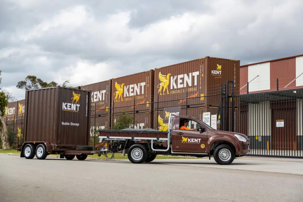 Kent Removals mobile storage container being transported outside secure storage facility