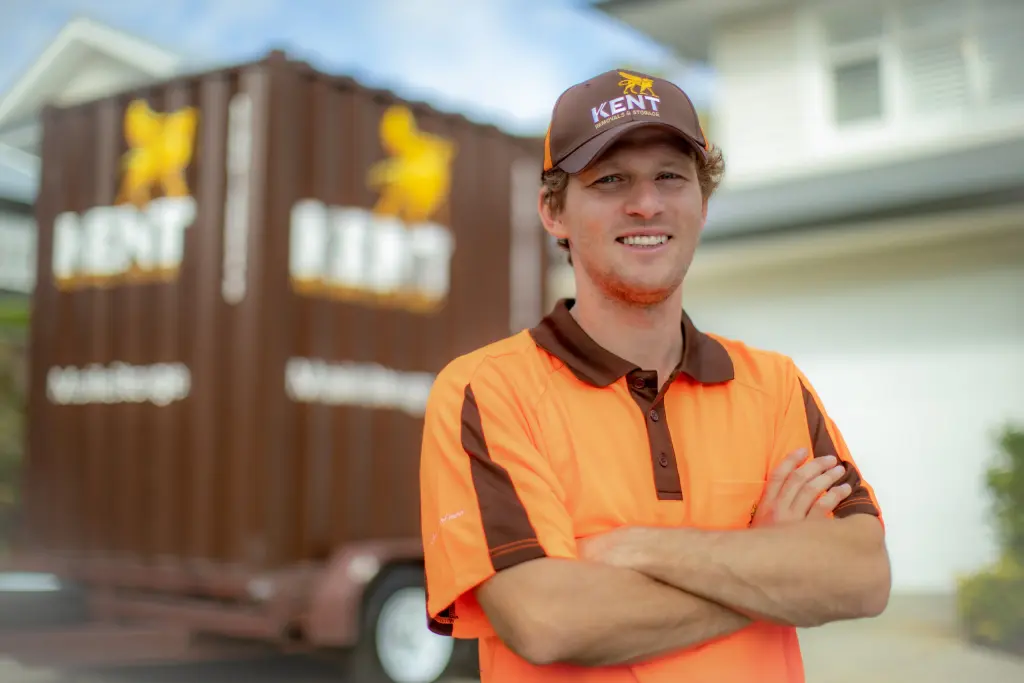 Kent Removals & Storage worker standing in front of portable storage container for home moving service