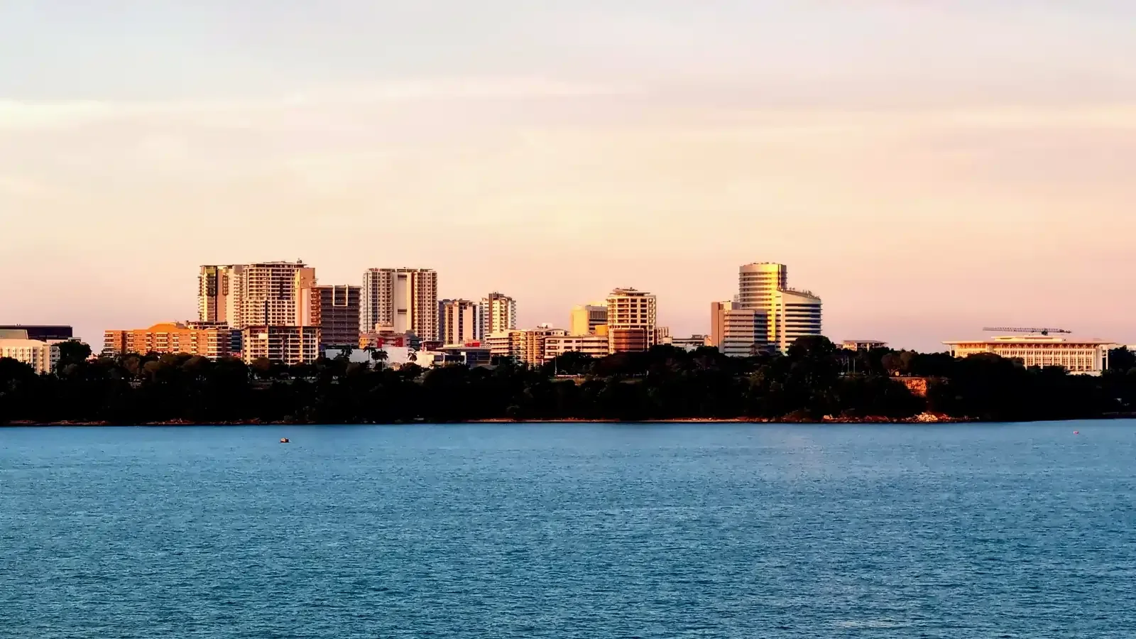 Darwin city skyline viewed from the harbor at sunset