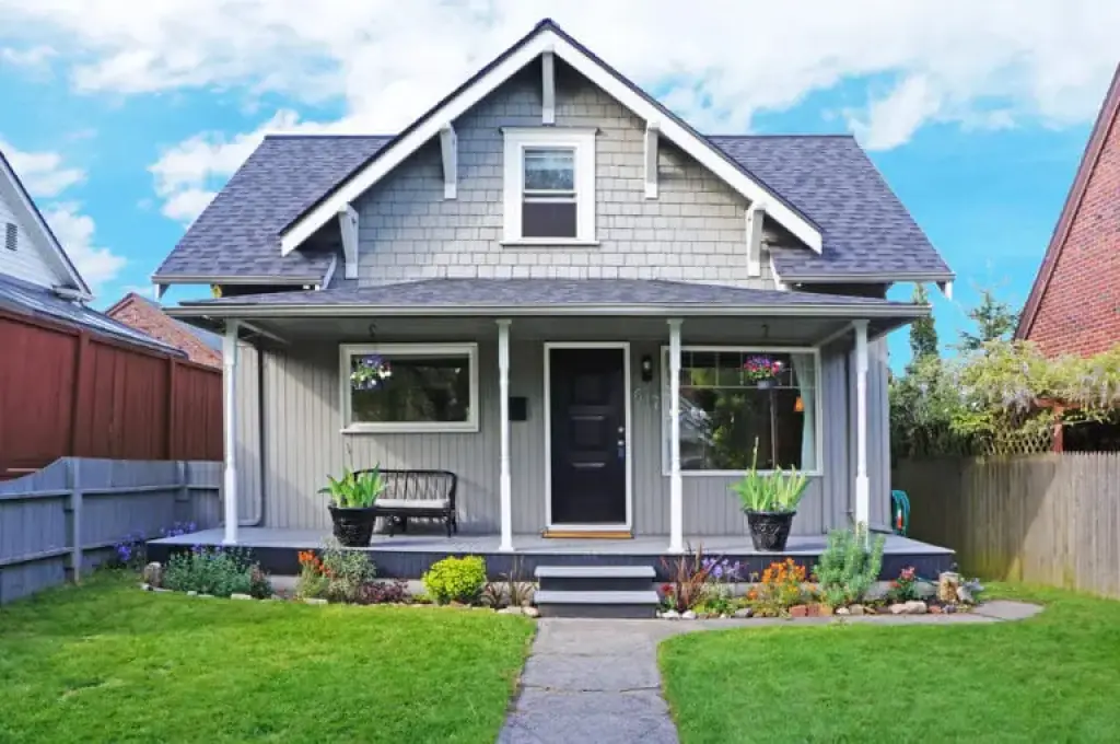 Suburban house exterior with front porch and garden