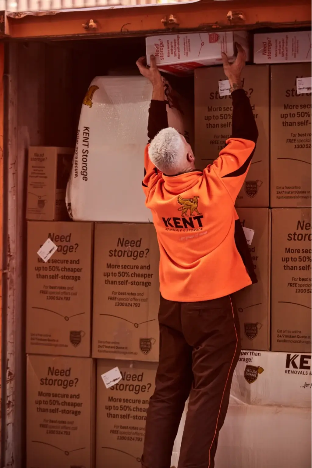 Kent Removals staff loading moving boxes into storage container