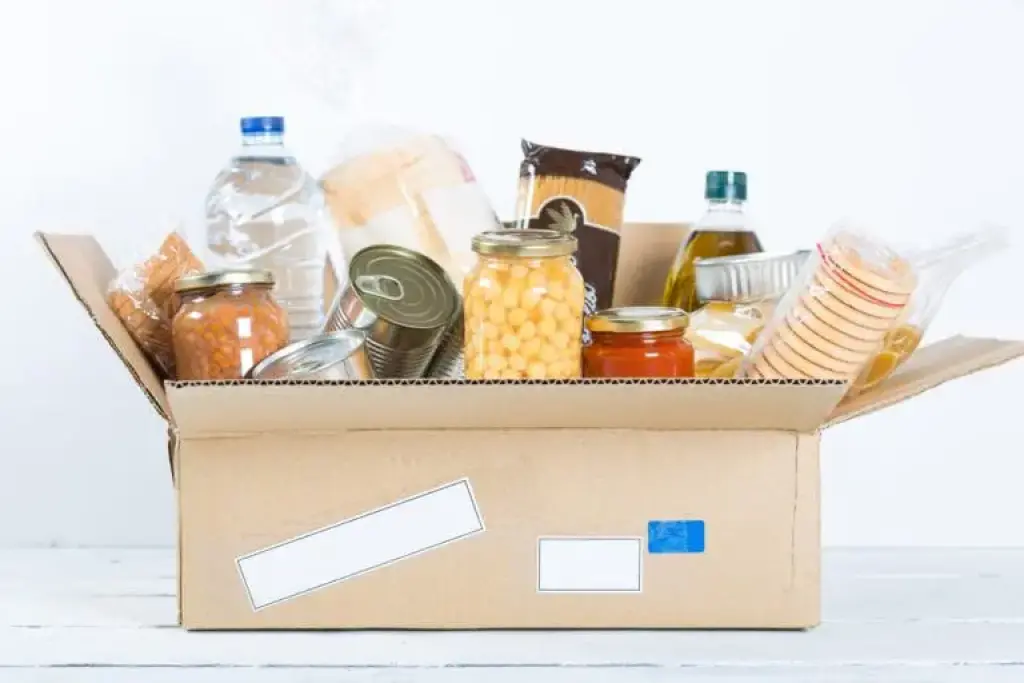 Moving box with groceries and pantry items