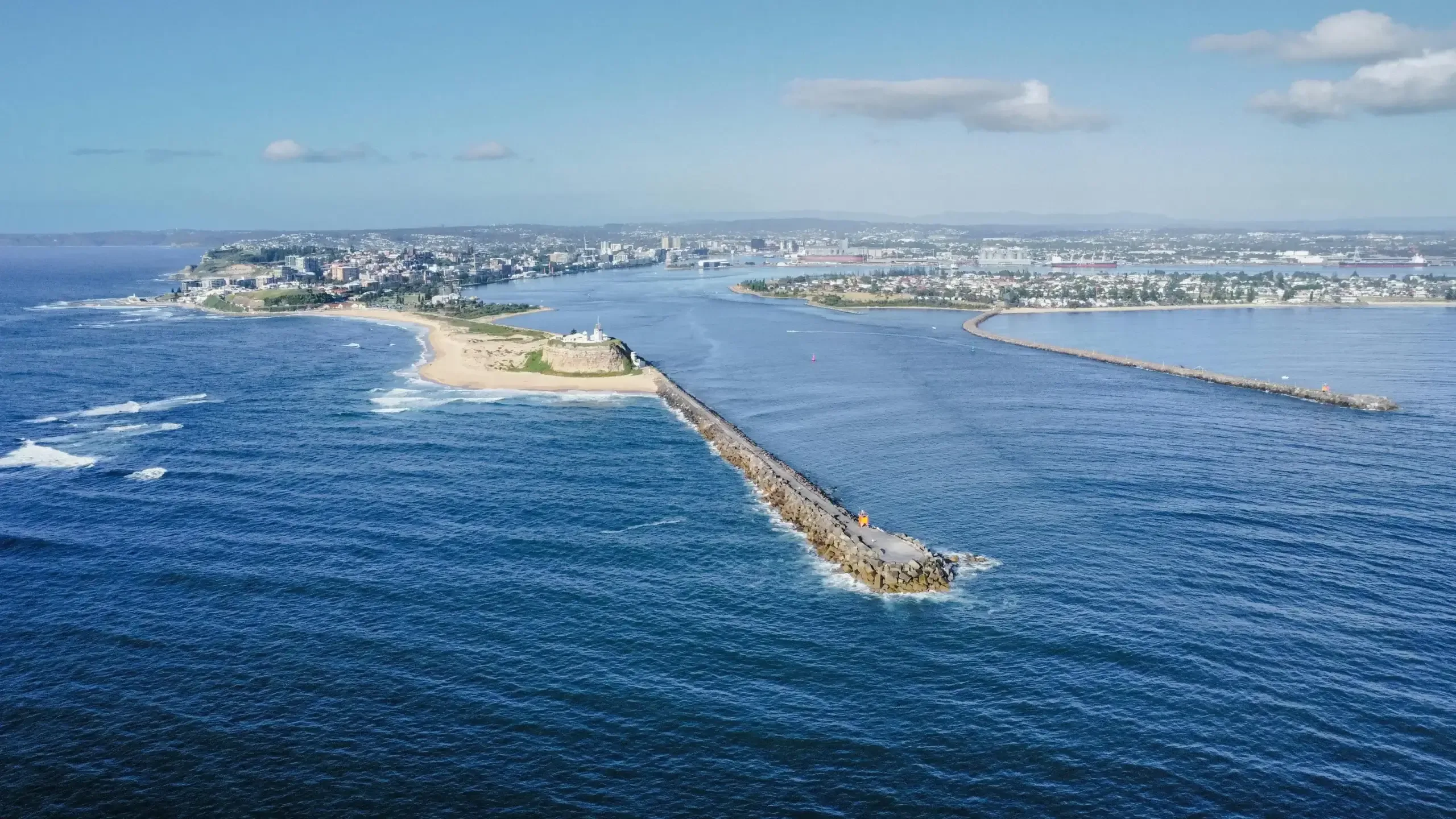 Aerial view of Newcastle breakwater, lighthouse, and harbor entrance
