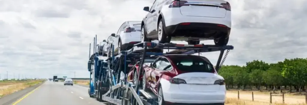 Car carrier truck transporting vehicles on highway